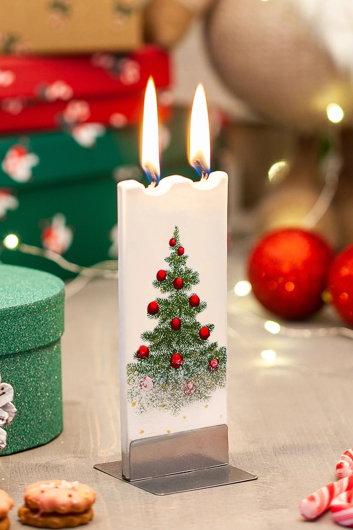 CHRISTMAS TREE WITH RED ORNAMENTS AND SNOW